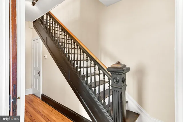 a living room with furniture and floor to ceiling windows