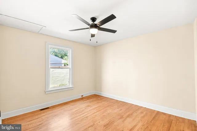 a kitchen with granite countertop cabinets stainless steel appliances a sink and a window