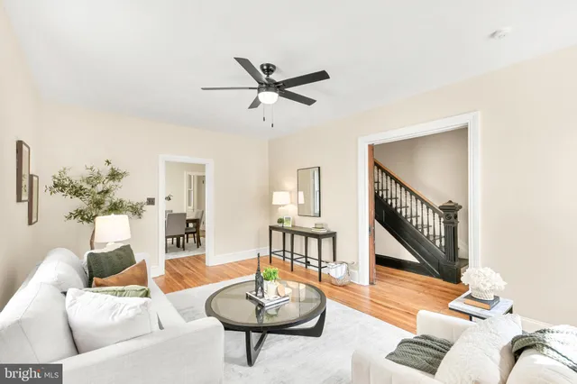 a view of a wooden door with a house and a yard
