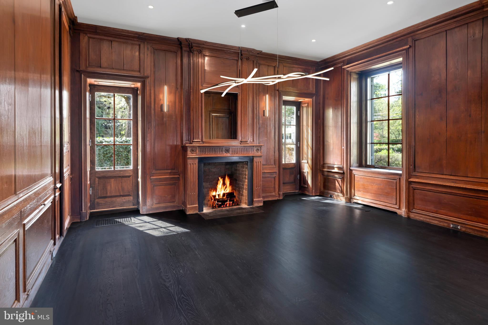87 Library Place Princeton, NJ 08540 - Photo 15 of 60 a view of an empty room with wooden floor fireplace and windows
