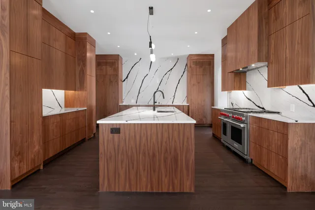 a view of a hallway with entryway and stairs