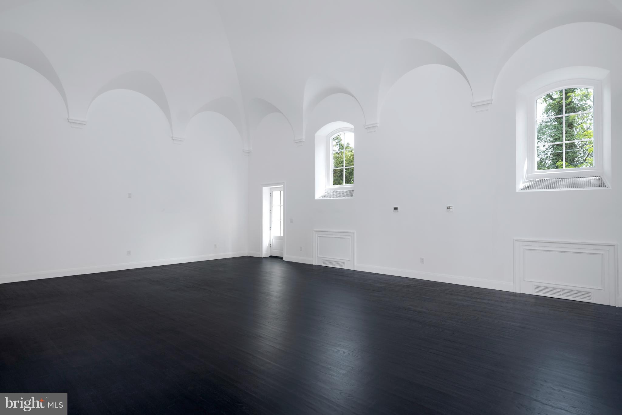 87 Library Place Princeton, NJ 08540 - Photo 27 of 60 an empty room with wooden floor and windows