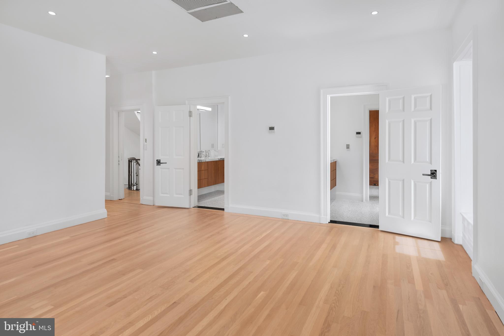 87 Library Place Princeton, NJ 08540 - Photo 33 of 60 a view of an empty room with wooden floor and a window