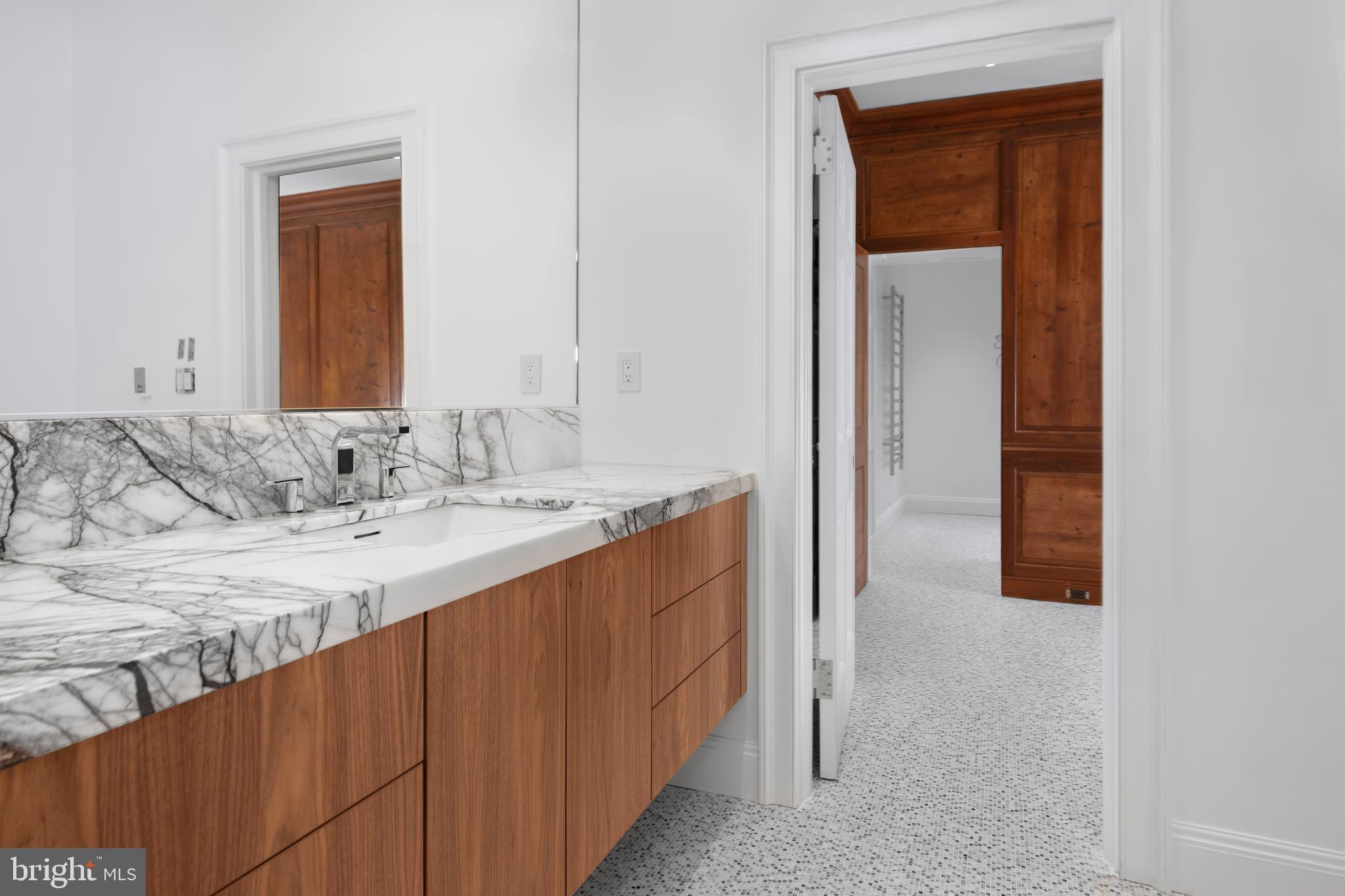 87 Library Place Princeton, NJ 08540 - Photo 35 of 60 a bathroom with a sink and a mirror