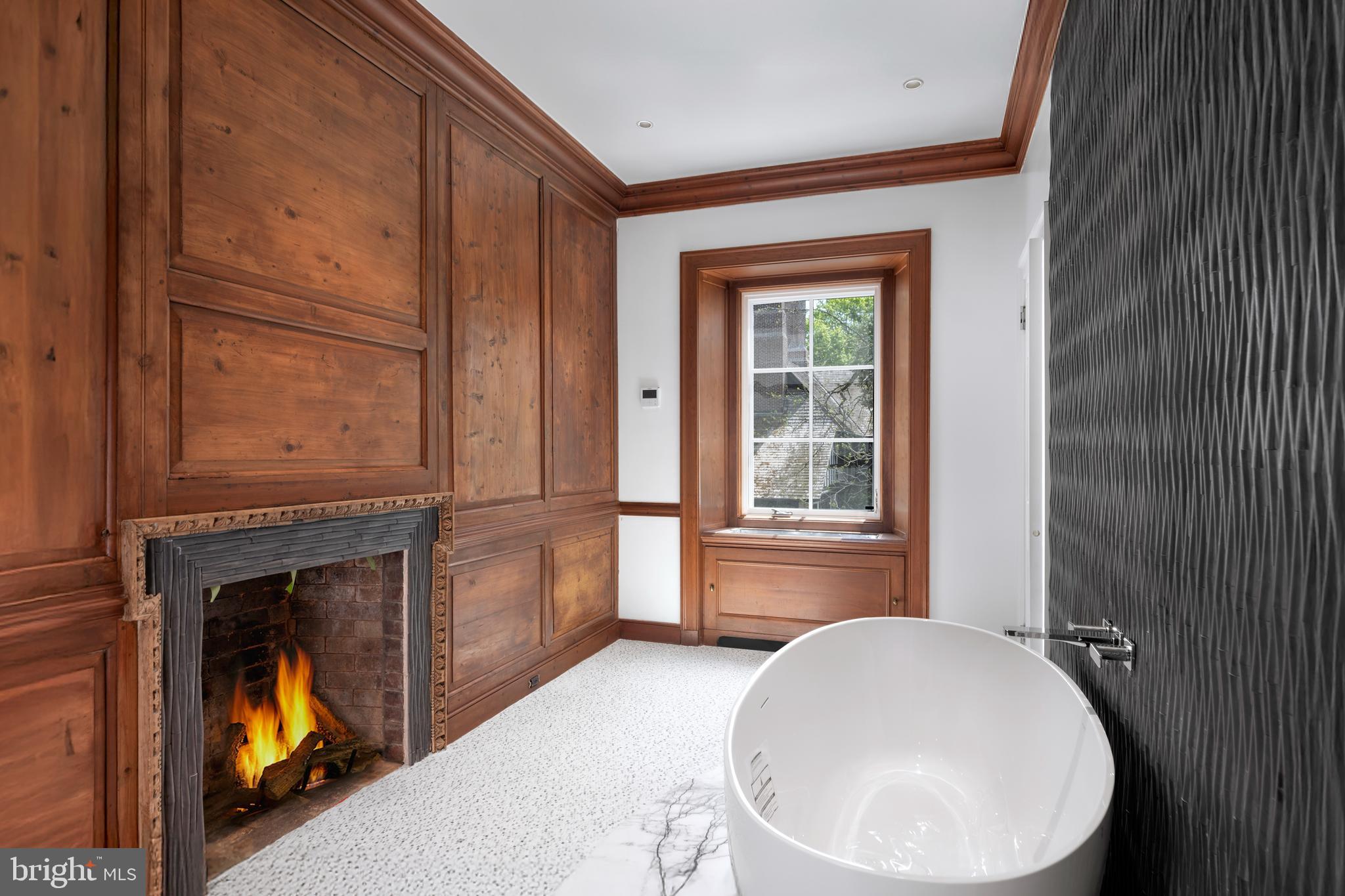 87 Library Place Princeton, NJ 08540 - Photo 37 of 60 a bathroom with a toilet sink and mirror