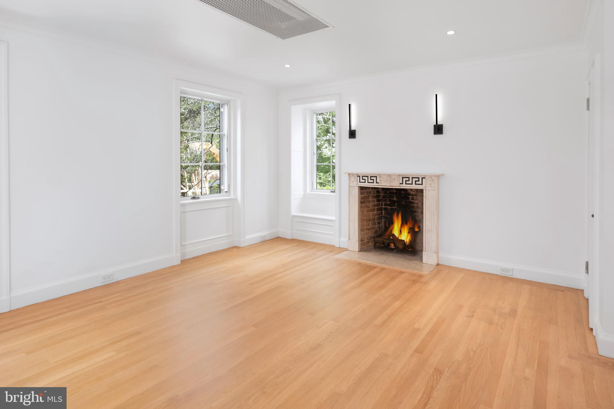 87 Library Place Princeton, NJ 08540 - Photo 44 of 60 an empty room with windows and fireplace