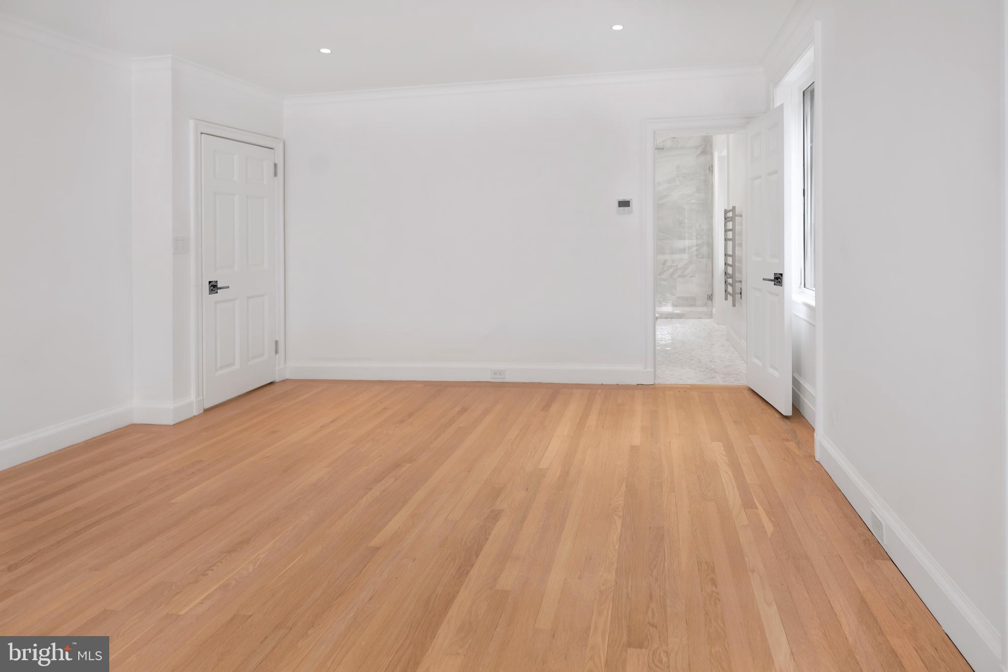 87 Library Place Princeton, NJ 08540 - Photo 45 of 60 a view of room with wooden floor and white walls