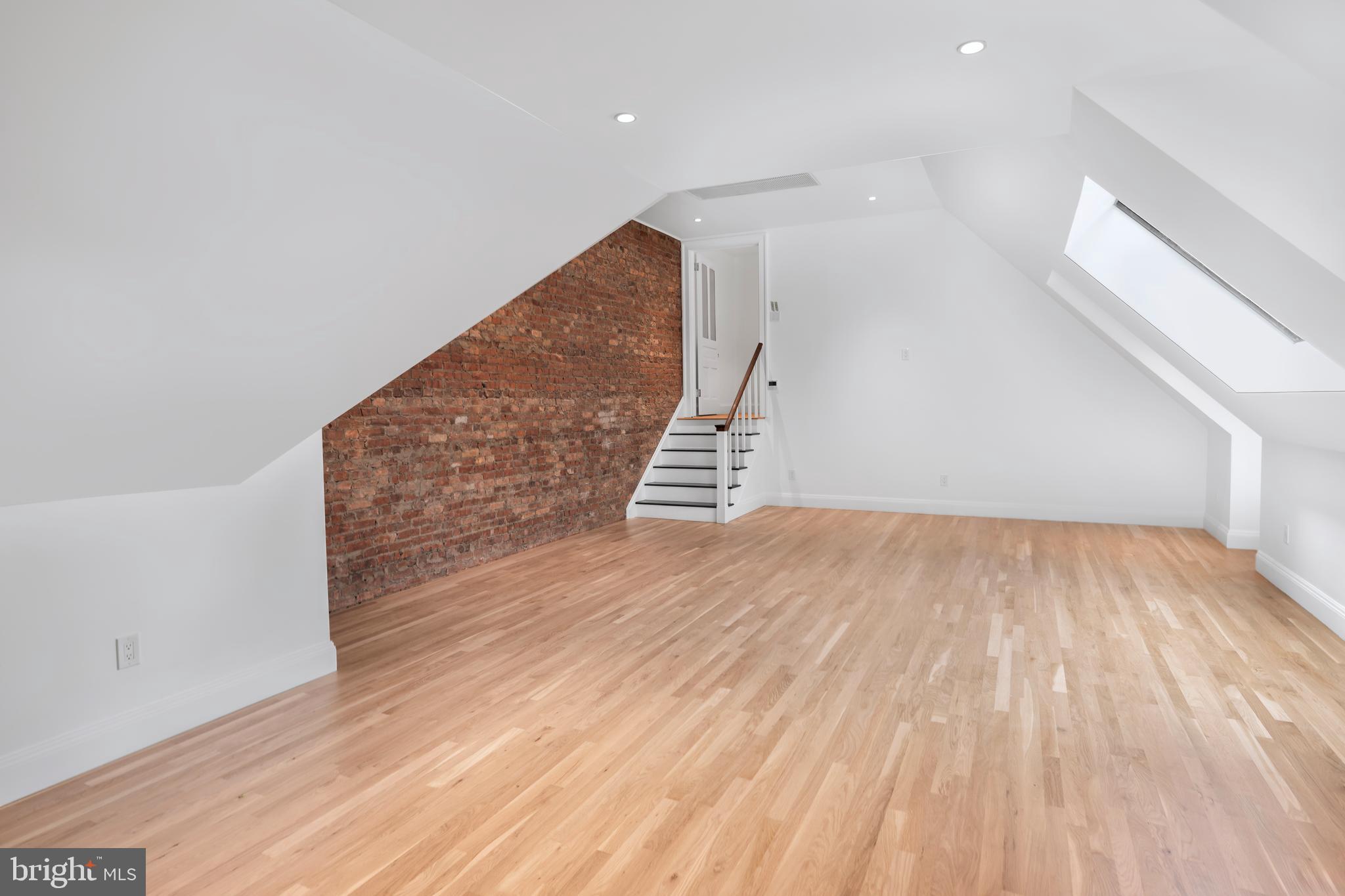 87 Library Place Princeton, NJ 08540 - Photo 48 of 60 wooden floor in an empty room with a window