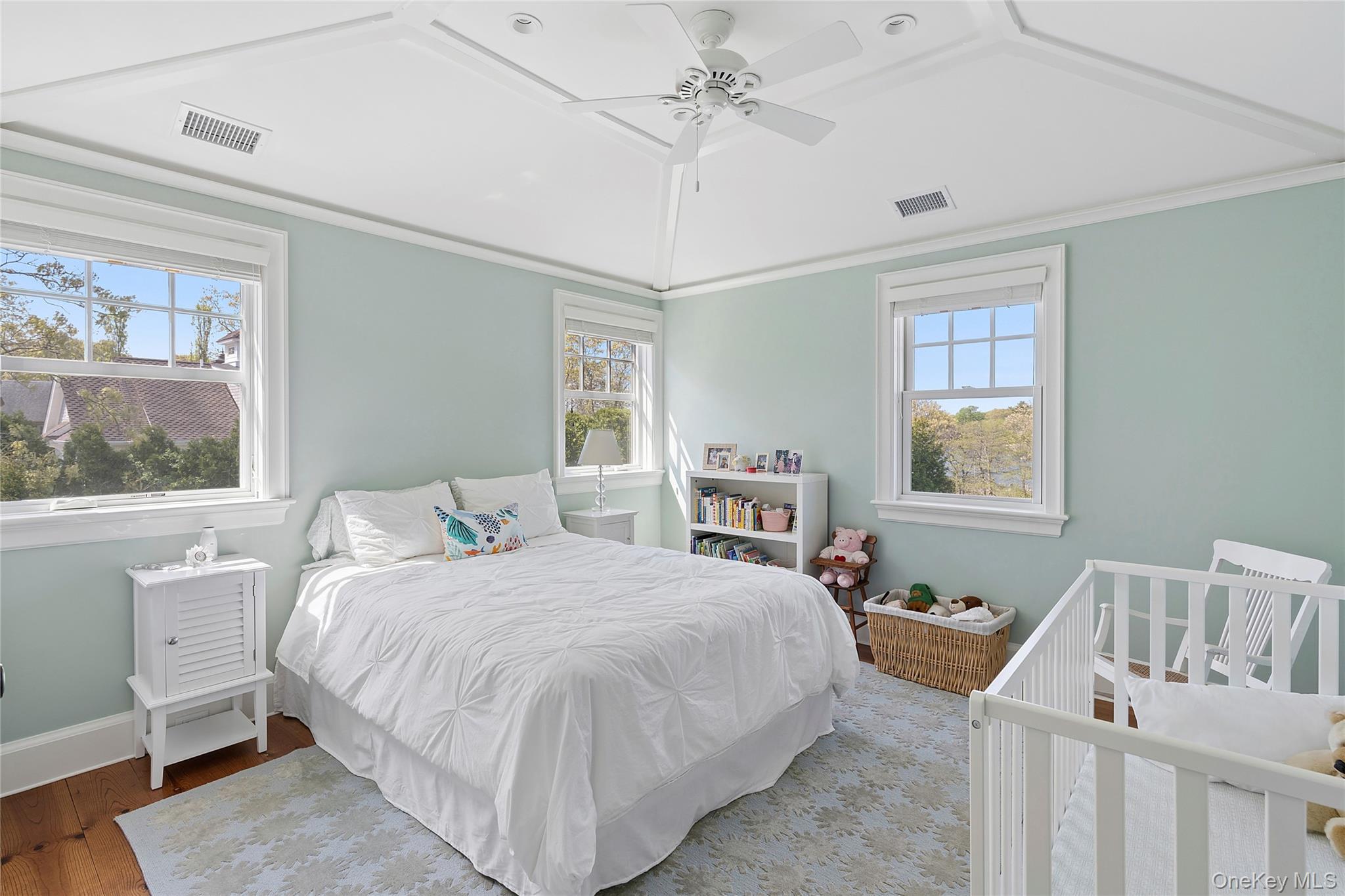 43 Old Main Road Quogue, NY 11959 - Photo 17 of 28 a bedroom with a bed and a window