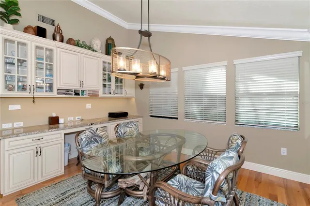 a very nice looking dining room with a table and chairs