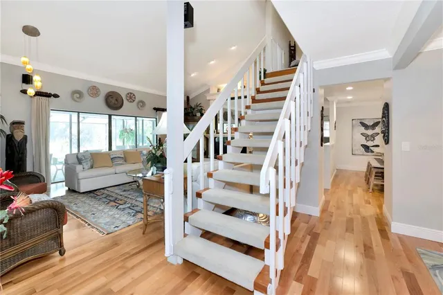 a view of a living room and entryway