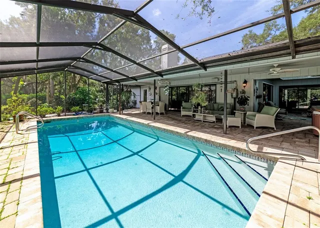a view of a swimming pool with a patio