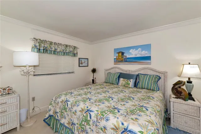 a bedroom with a bed and a lamp on table