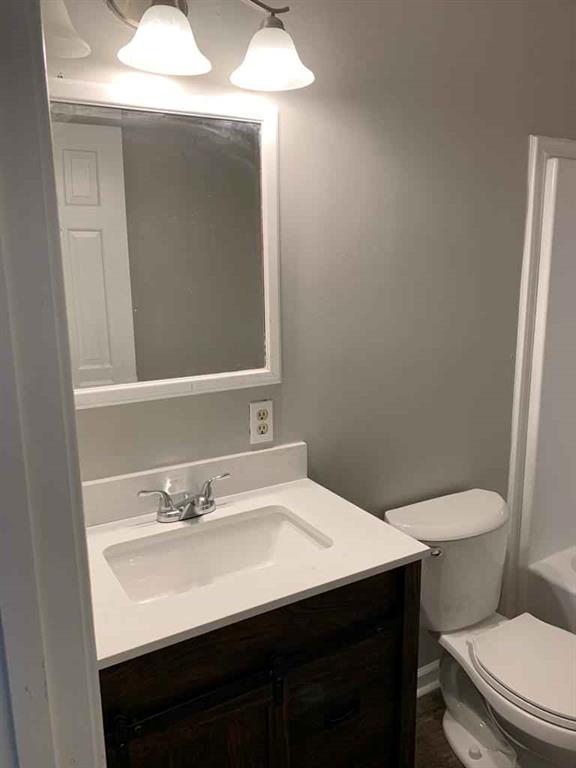 846 Idlewood Road Winder, GA 30680 - Photo 12 of 27 a bathroom with a sink vanity and toilet