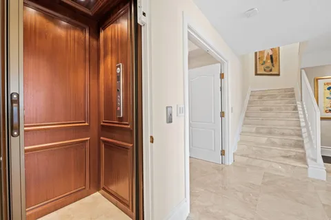 a view of elevator with hallway