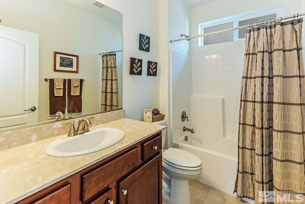 10350 Culiacan Pass Trail Reno, NV 89521 - Photo 13 of 20 a bathroom with a sink toilet and shower
