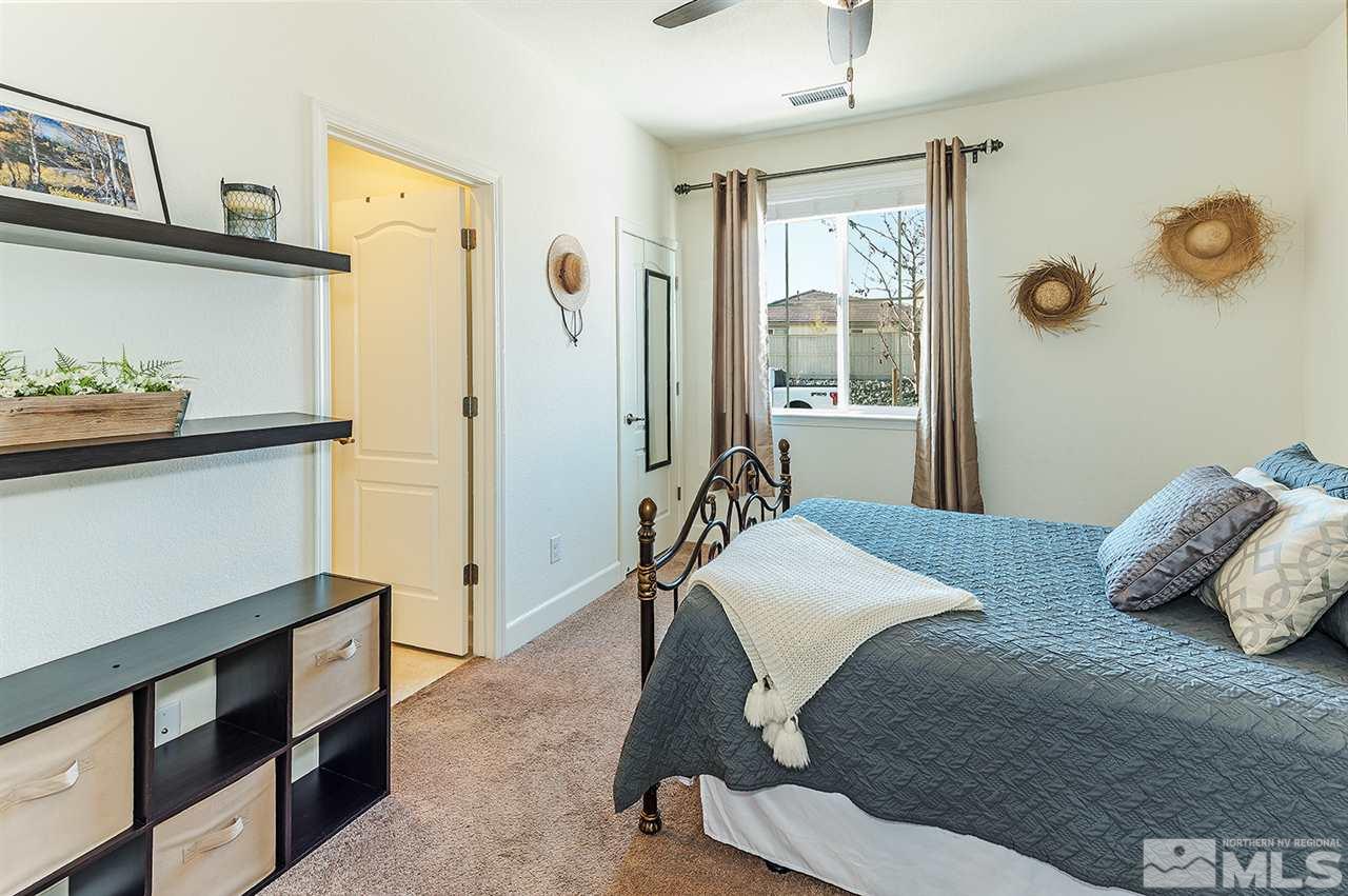 10350 Culiacan Pass Trail Reno, NV 89521 - Photo 17 of 20 a bedroom with a bed and a window