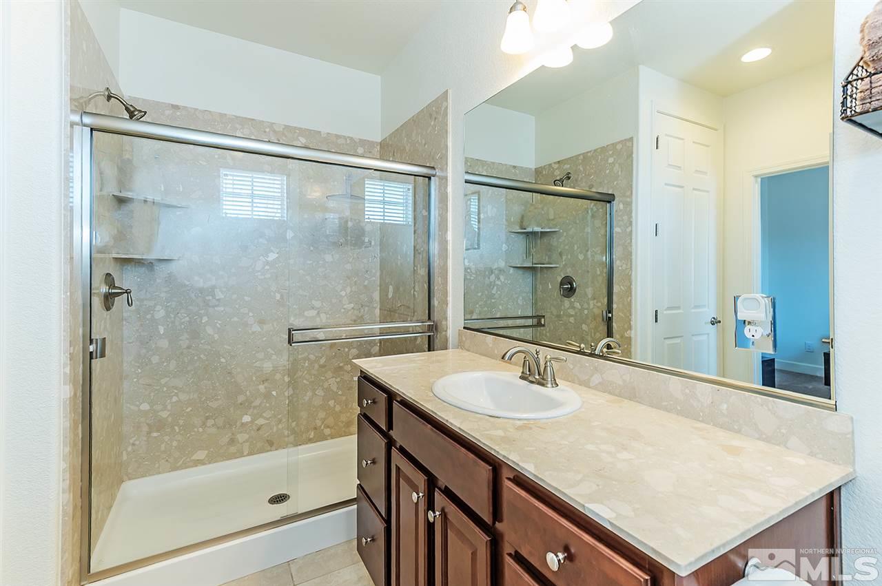 10350 Culiacan Pass Trail Reno, NV 89521 - Photo 18 of 20 a bathroom with a sink shower and a mirror