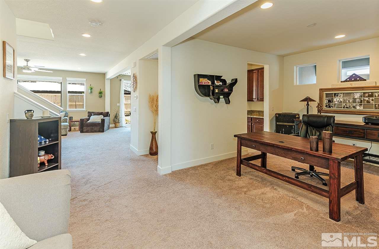 10350 Culiacan Pass Trail Reno, NV 89521 - Photo 2 of 20 a living room with furniture and a flat screen tv