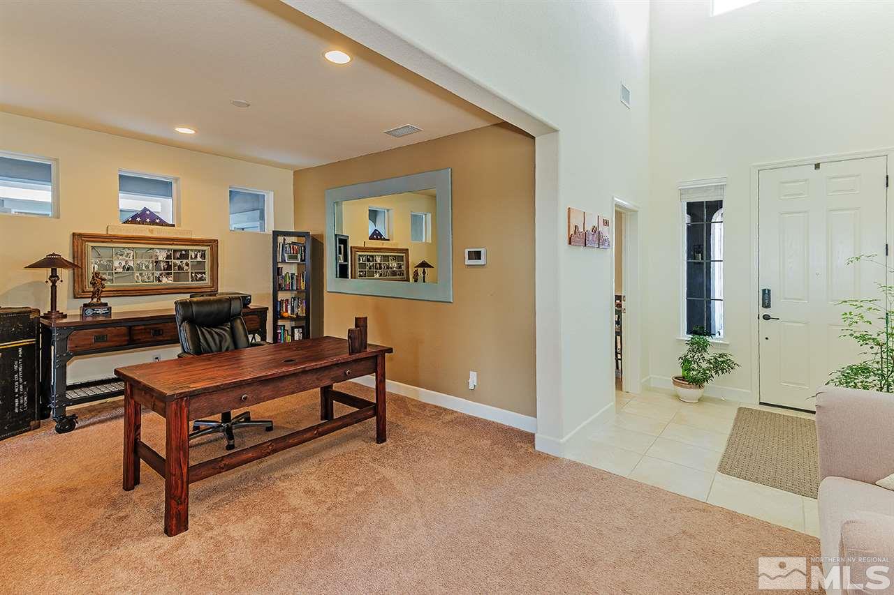 10350 Culiacan Pass Trail Reno, NV 89521 - Photo 3 of 20 a living room with furniture and a potted plant