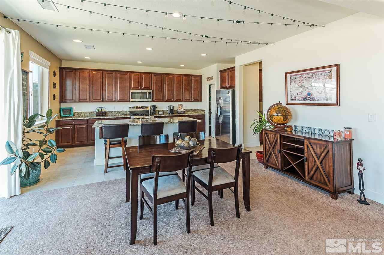 10350 Culiacan Pass Trail Reno, NV 89521 - Photo 5 of 20 a view of a dining room with furniture window and wooden floor