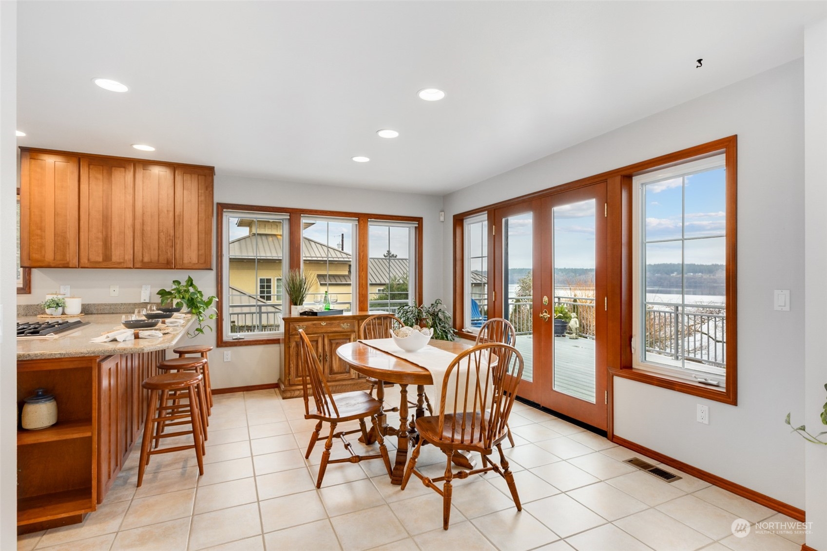9942 Johnson Point Road Northeast Olympia, WA 98516 - Photo 11 of 34 a view of a dining room with furniture window and outside view