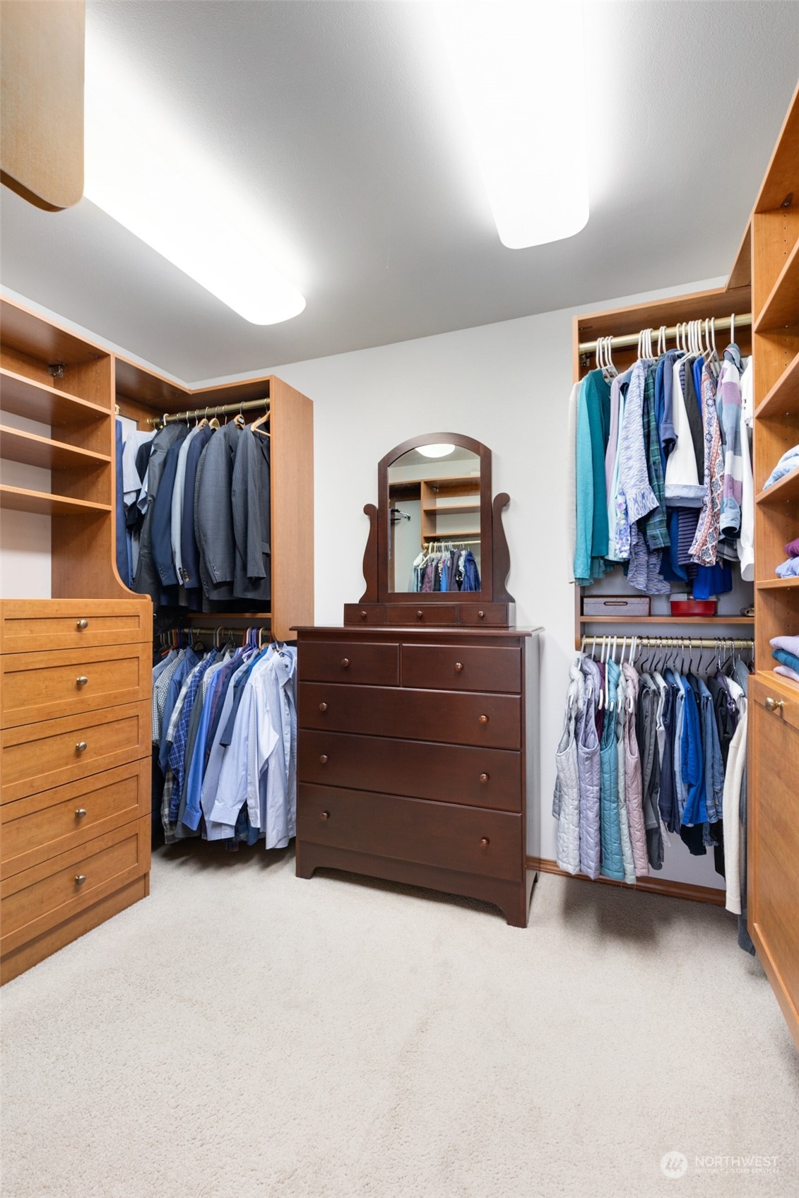 9942 Johnson Point Road Northeast Olympia, WA 98516 - Photo 15 of 34 a view of walk in closet with clothes and shoes