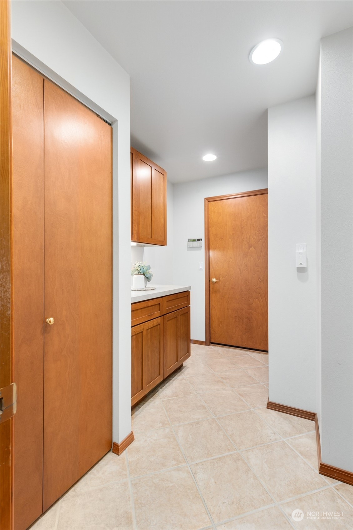 9942 Johnson Point Road Northeast Olympia, WA 98516 - Photo 18 of 34 a view of hallway with cabinets