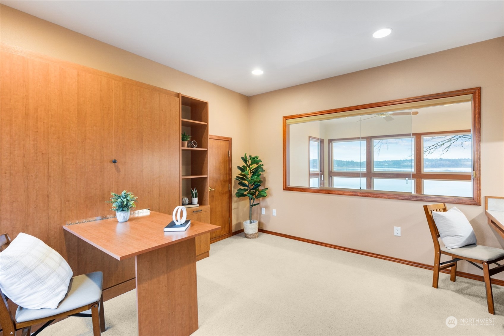 9942 Johnson Point Road Northeast Olympia, WA 98516 - Photo 22 of 34 a living room with a large window