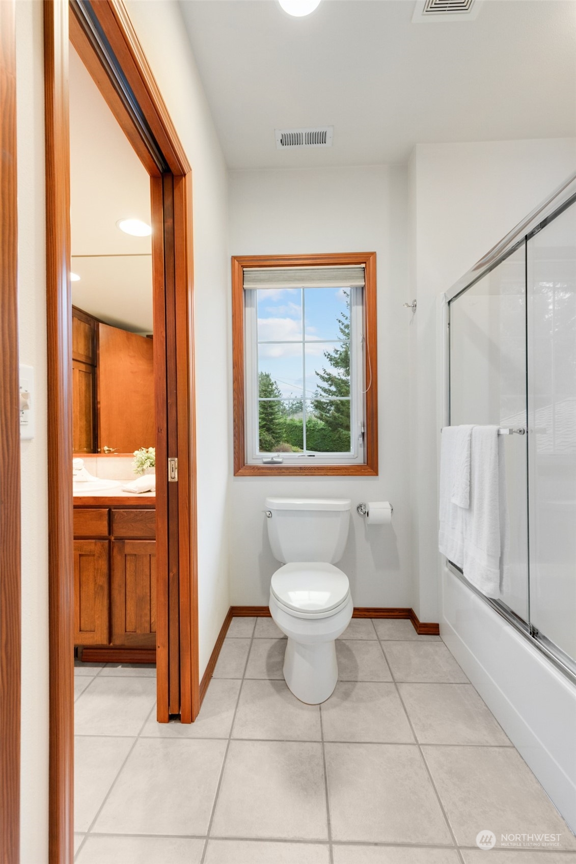 9942 Johnson Point Road Northeast Olympia, WA 98516 - Photo 25 of 34 a bathroom with a toilet sink and shower