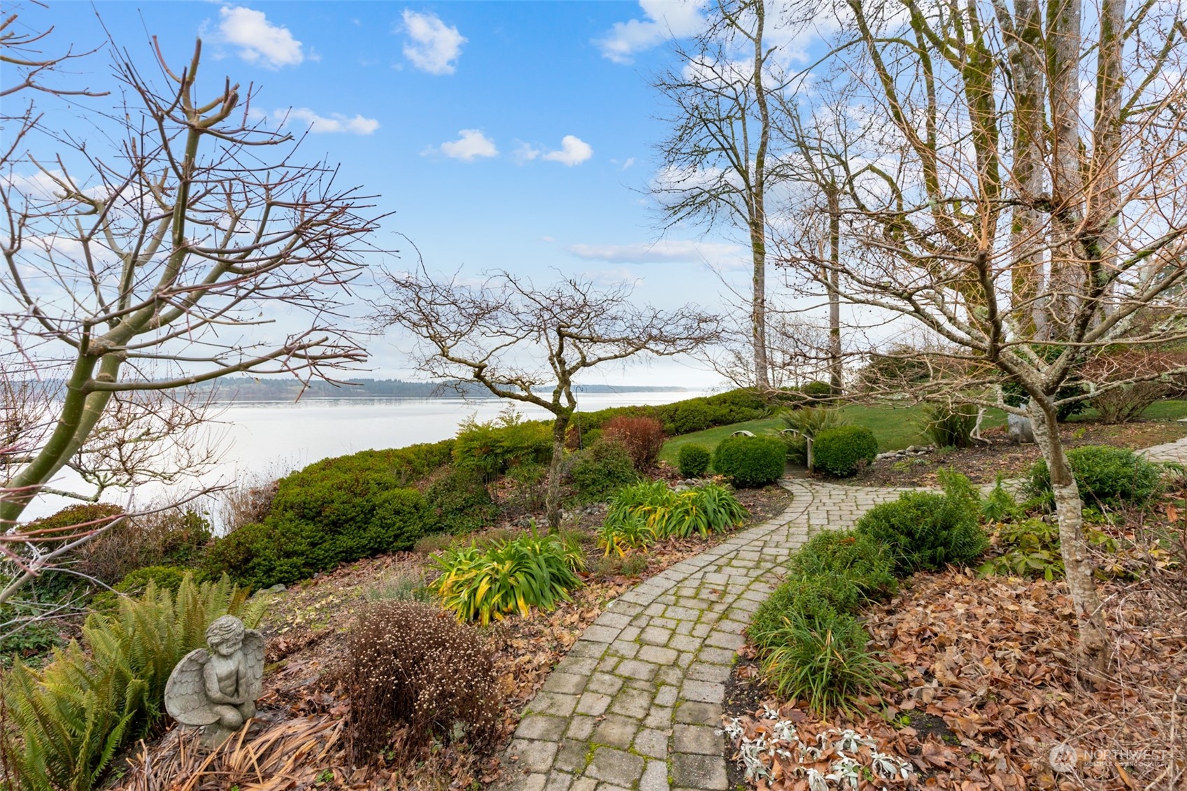 9942 Johnson Point Road Northeast Olympia, WA 98516 - Photo 29 of 34 a view of a garden with a tree