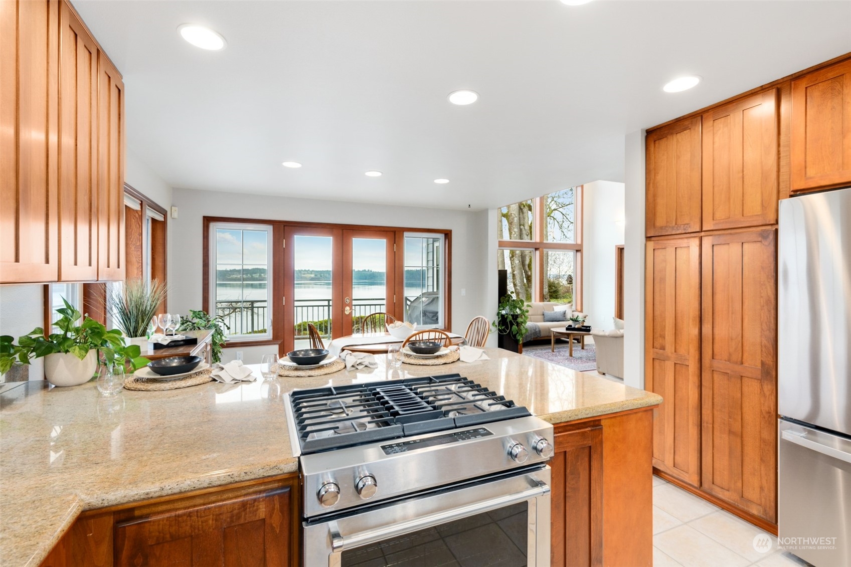 9942 Johnson Point Road Northeast Olympia, WA 98516 - Photo 8 of 34 a kitchen with sink stove and refrigerator