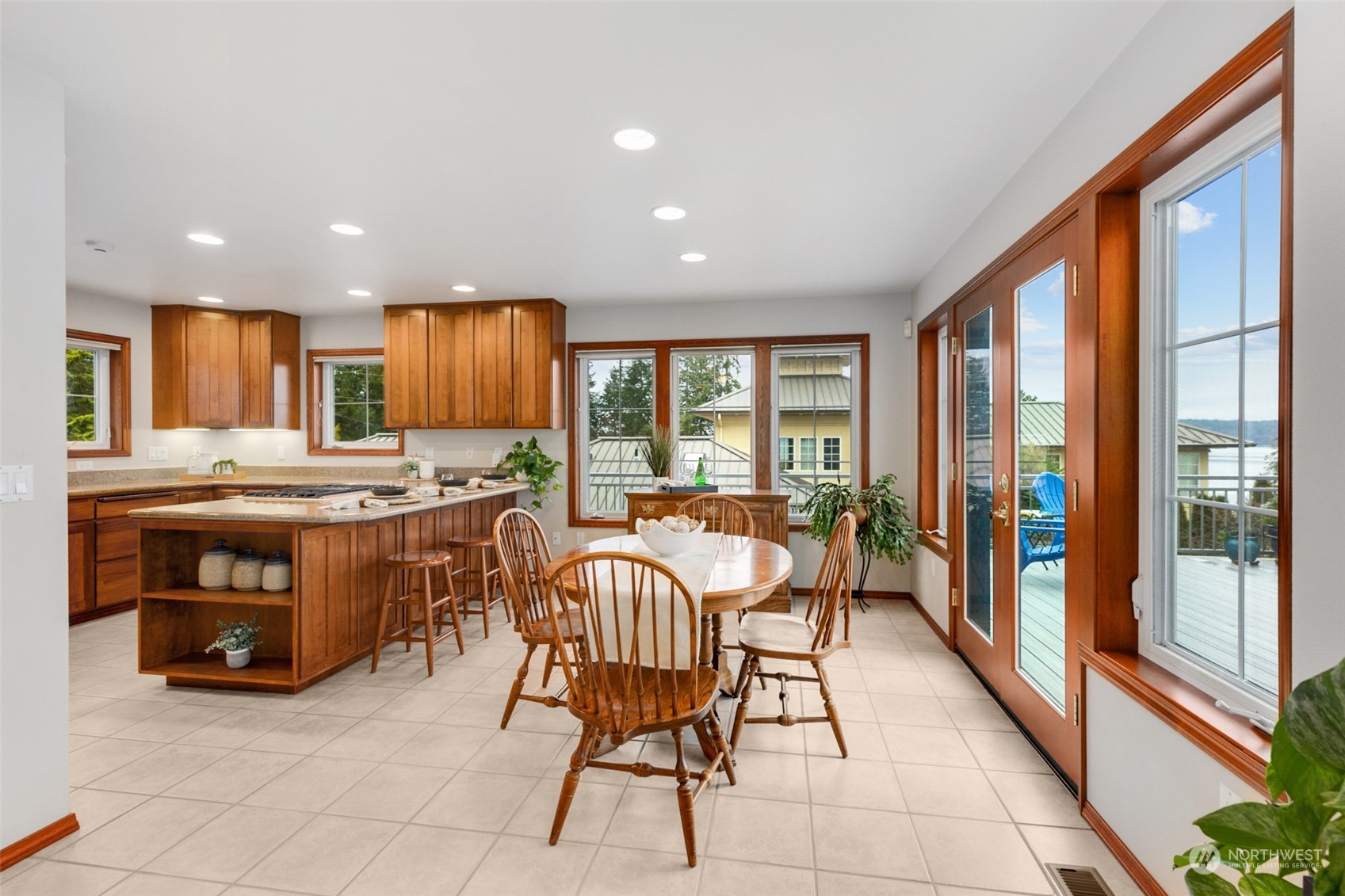 9942 Johnson Point Road Northeast Olympia, WA 98516 - Photo 10 of 34 a living room with stainless steel appliances furniture cabinets and a large window