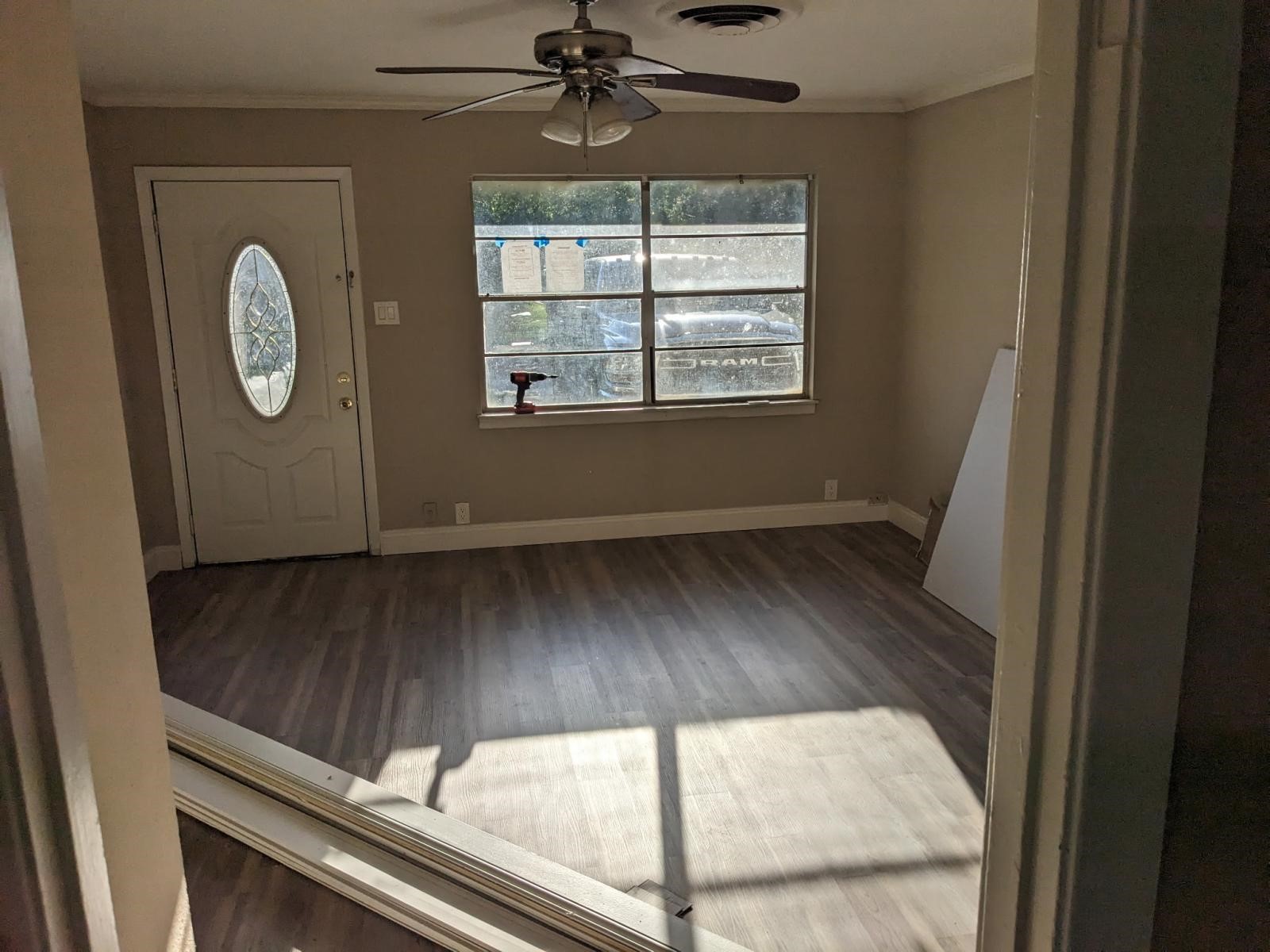 3470 Kipling Drive Beaumont, TX 77706 - Photo 17 of 21 an empty room with wooden floor fan and windows