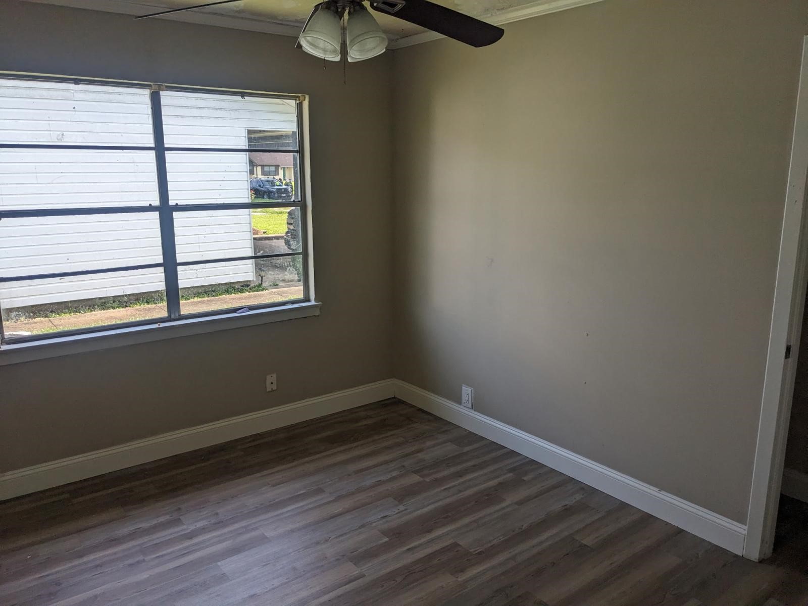 3470 Kipling Drive Beaumont, TX 77706 - Photo 7 of 21 a view of a small space with wooden floor and a window