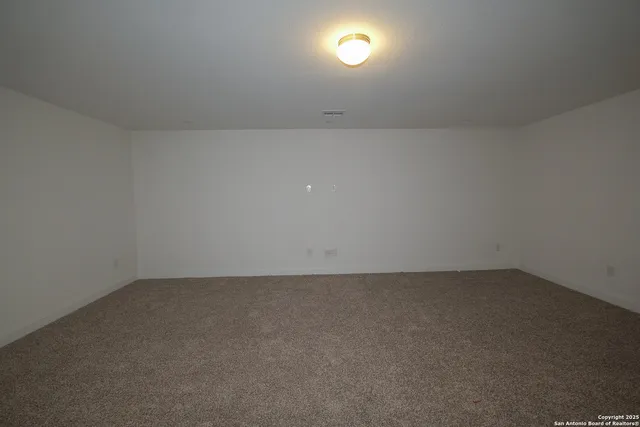 an empty room with a empty space and a window