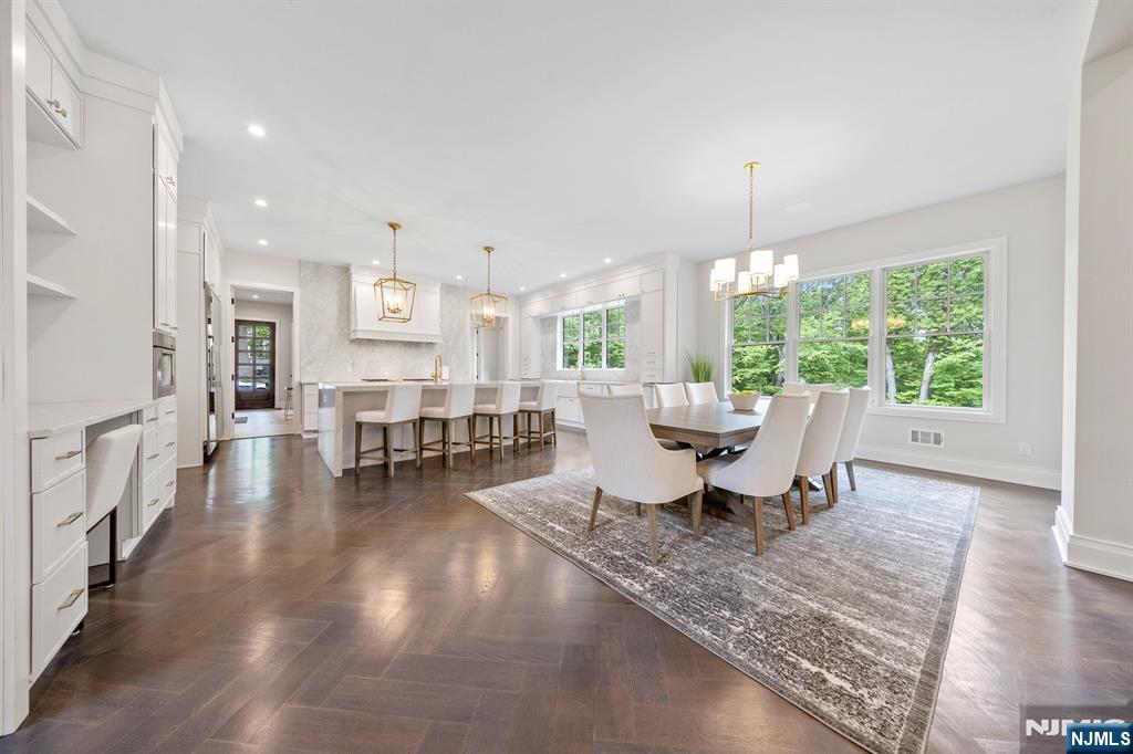 396 Knollwood Road Ridgewood, NJ 07450 - Photo 23 of 50 a living room with furniture and a table with kitchen view