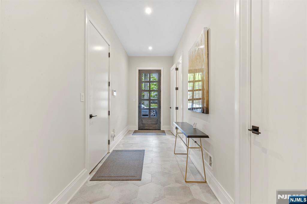396 Knollwood Road Ridgewood, NJ 07450 - Photo 29 of 50 a view of hallway with furniture and a window