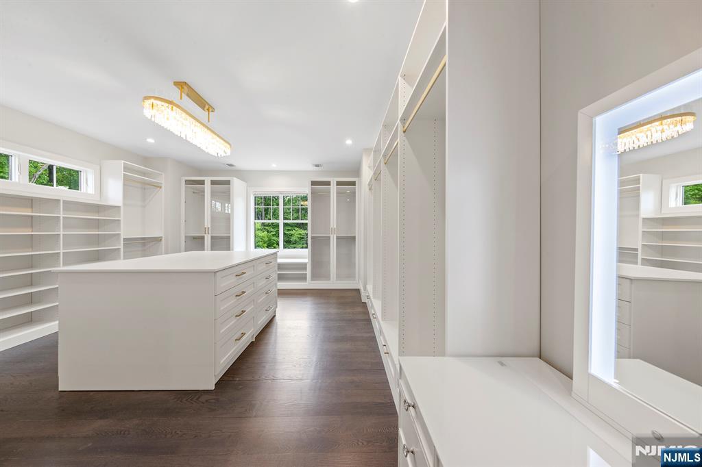 396 Knollwood Road Ridgewood, NJ 07450 - Photo 36 of 50 a large white kitchen with hardwood floor and a large window