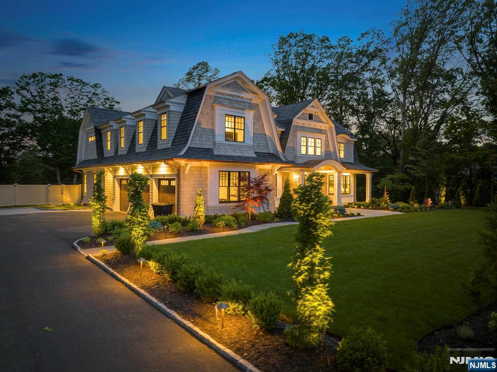 396 Knollwood Road Ridgewood, NJ 07450 - Photo 4 of 50 a front view of a house with a yard