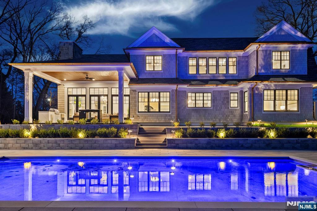 396 Knollwood Road Ridgewood, NJ 07450 - Photo 48 of 50 a front view of a house with a swimming pool