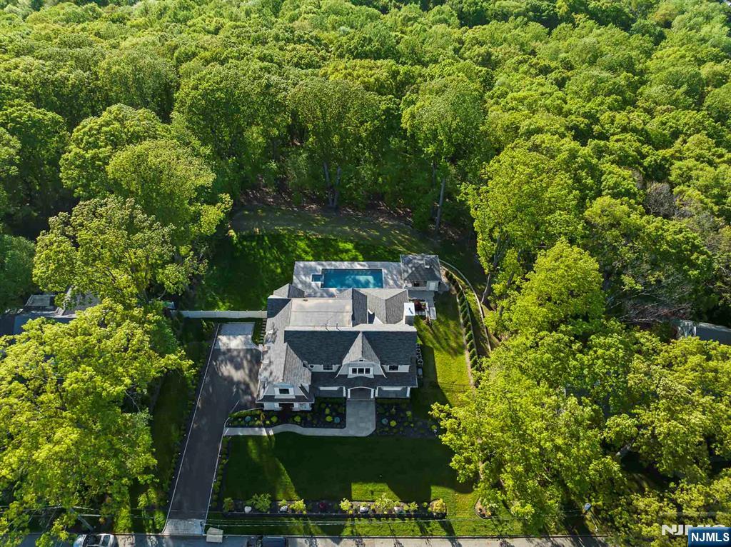396 Knollwood Road Ridgewood, NJ 07450 - Photo 50 of 50 a view of a house with a patio and garden