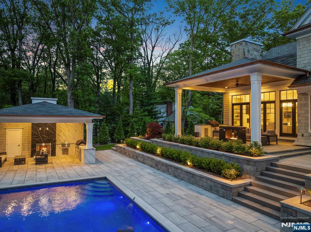 396 Knollwood Road Ridgewood, NJ 07450 - Photo 7 of 50 swimming pool view with a seating space and garden view