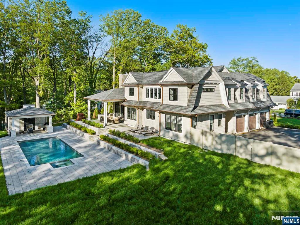 396 Knollwood Road Ridgewood, NJ 07450 - Photo 10 of 50 a front view of a house with a yard