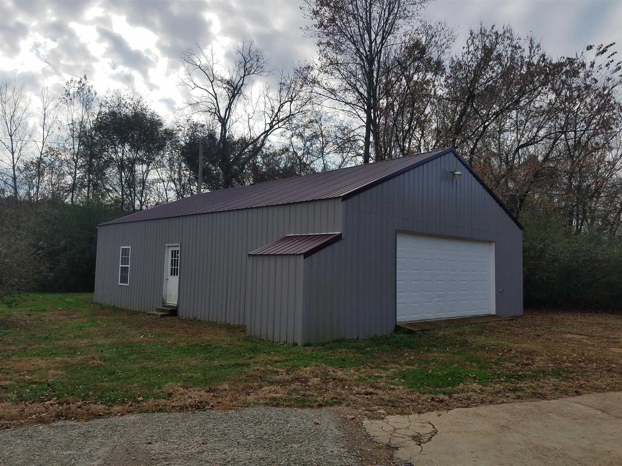 1253 Long Creek Road Dover, TN 37058 - Photo 5 of 12 Large 32x48 Garage / Workshop with additional electric and water hookup on the side for an RV