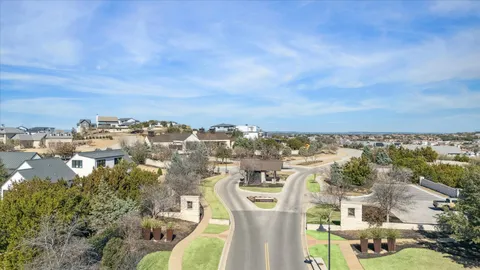 a view of a big yard with a large tree