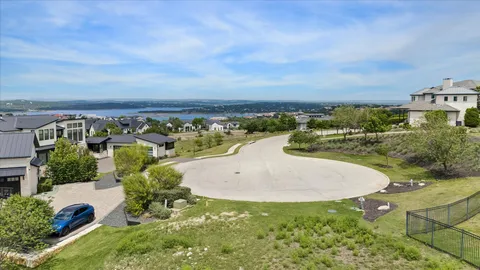 an aerial view of a house with yard swimming pool and outdoor seating