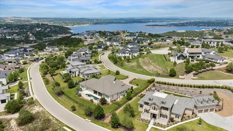 an aerial view of a residential houses with outdoor space
