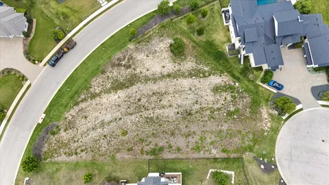 a view of a swimming pool with a yard