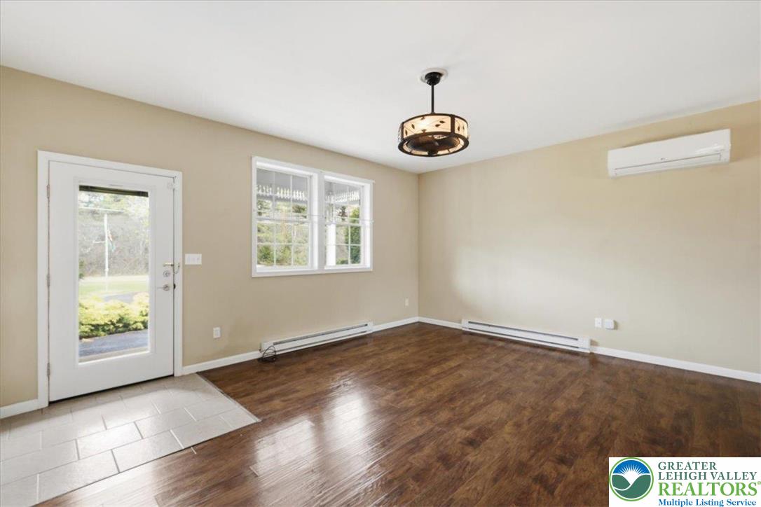 64 Robertson Road Jim Thorpe, PA 18229 - Photo 12 of 54 an empty room with wooden floor and windows